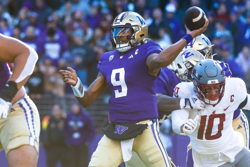 Nov 25, 2023; Seattle, Washington, USA; Washington Huskies quarterback Michael Penix Jr. (9) passes against the Washington State Cougars during the second quarter at Alaska Airlines Field at Husky Stadium. Mandatory Credit: Joe Nicholson-USA TODAY Sports