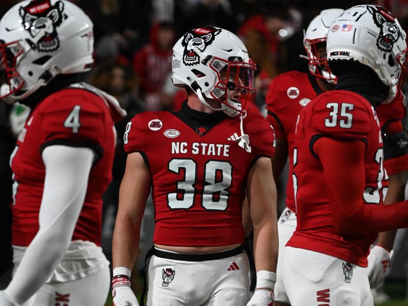 Nov 25, 2023; Raleigh, North Carolina, USA;  North Carolina State Wolfpack safety Alex Martjuchin (38) warms up prior to a game against the North Carolina Tar Heels at Carter-Finley Stadium. Mandatory Credit: Rob Kinnan-USA TODAY Sports