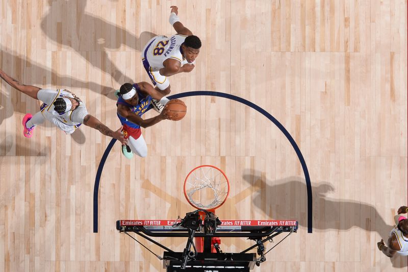 DENVER, CO - APRIL 20: Peyton Watson #8 of the Denver Nuggets drives to the basket during the game against the Los Angeles Lakers during Round 1 Game 1 of the 2024 NBA Playoffs on April 20, 2024 at the Ball Arena in Denver, Colorado. NOTE TO USER: User expressly acknowledges and agrees that, by downloading and/or using this Photograph, user is consenting to the terms and conditions of the Getty Images License Agreement. Mandatory Copyright Notice: Copyright 2024 NBAE (Photo by Garrett Ellwood/NBAE via Getty Images)