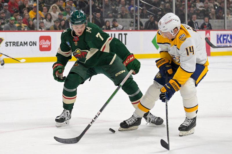 Jan 25, 2024; Saint Paul, Minnesota, USA; Minnesota Wild defenseman Brock Faber (7) poke-checks the puck away from Nashville Predators forward Gustav Nyquist (14) during the first period at Xcel Energy Center. Mandatory Credit: Nick Wosika-USA TODAY Sports