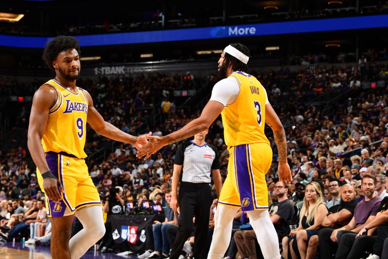 PHOENIX, AZ - OCTOBER 17: Bronny James #9 and Anthony Davis #3 of the Los Angeles Lakers high five during the game against the Phoenix Suns during a NBA Preseason game on October 17, 2024 at Footprint Center in Phoenix, Arizona. NOTE TO USER: User expressly acknowledges and agrees that, by downloading and or using this photograph, user is consenting to the terms and conditions of the Getty Images License Agreement. Mandatory Copyright Notice: Copyright 2024 NBAE (Photo by Barry Gossage/NBAE via Getty Images)