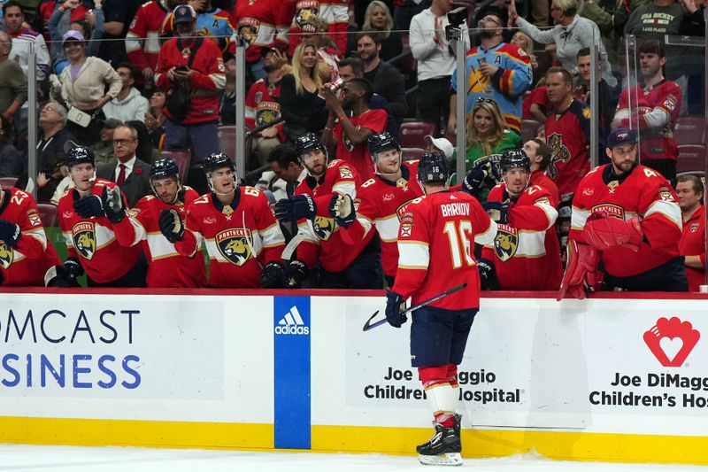 Nov 10, 2023; Sunrise, Florida, USA; Florida Panthers center Aleksander Barkov (16) celebrates with teammates after scoring a goal against the Carolina Hurricanes during the second period at Amerant Bank Arena. Mandatory Credit: Jasen Vinlove-USA TODAY Sports