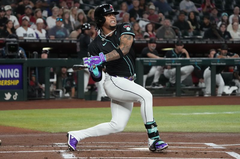 Aug 12, 2024; Phoenix, Arizona, USA; Arizona Diamondbacks second base Ketel Marte (4) reacts after twisting his foot against the Colorado Rockies in the first inning at Chase Field. Mandatory Credit: Rick Scuteri-USA TODAY Sports