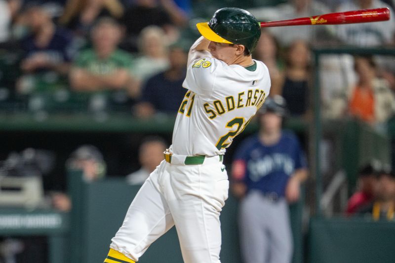 May 6, 2025; West Sacramento, California, USA;   Athletics left fielder Tyler Soderstrom (21) hits a double during the sixth inning against the Seattle Mariners at Sutter Health Park. Mandatory Credit: Neville E. Guard-Imagn Images