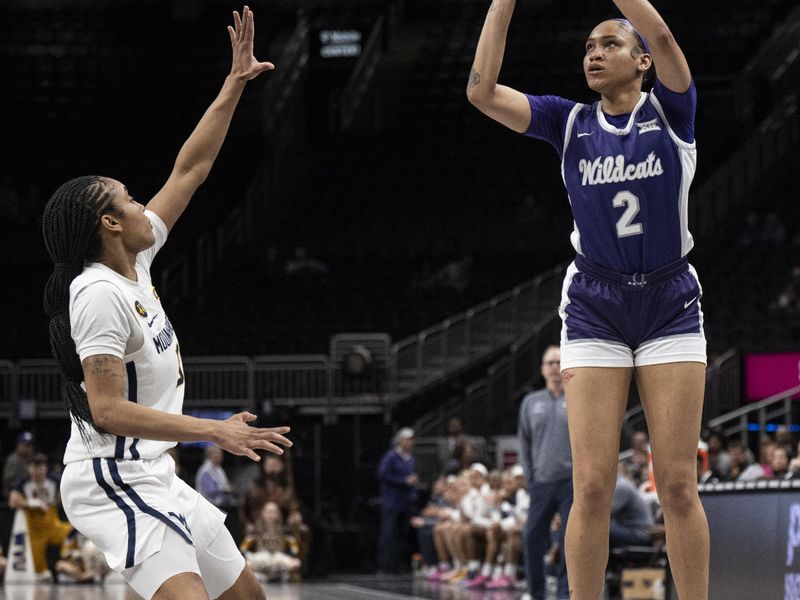 Mar 7, 2025; Kansas City, MO, USA; Kansas State Wildcats forward Temira Poindexter (2) shoots the ball while defended by West Virginia Mountaineers guard Sydney Shaw (5) in the third quarter at T-Mobile Center. Mandatory Credit: Amy Kontras-Imagn Images