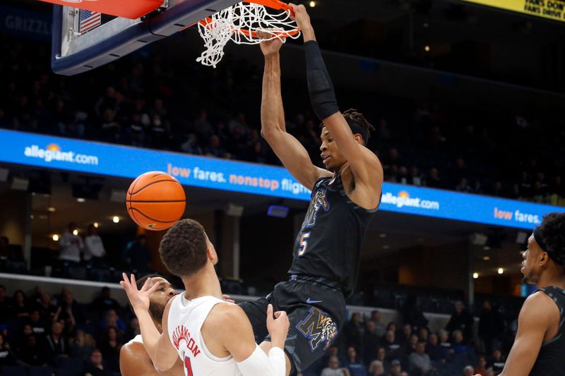 Jan 26, 2023; Memphis, Tennessee, USA; Memphis Tigers forward Kaodirichi Akobundu-Ehiogu (5) dunks during the first half against the Southern Methodist Mustangs at FedExForum. Mandatory Credit: Petre Thomas-USA TODAY Sports