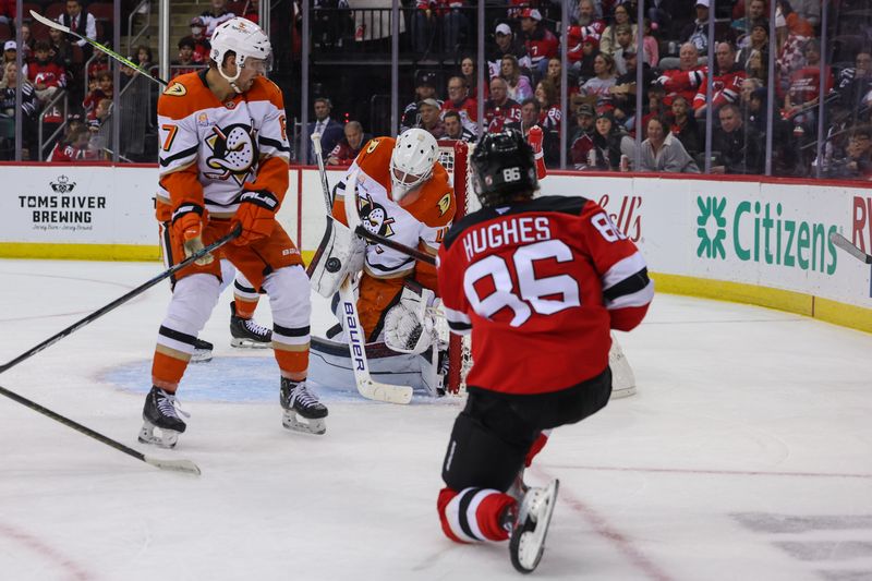 Oct 27, 2024; Newark, New Jersey, USA; Anaheim Ducks goaltender James Reimer (47) makes a save on New Jersey Devils center Jack Hughes (86) during the second period at Prudential Center. Mandatory Credit: Ed Mulholland-Imagn Images