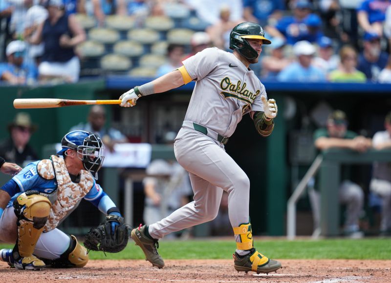 May 19, 2024; Kansas City, Missouri, USA; Oakland Athletics right fielder Seth Brown (15) hits a single against the Kansas City Royals during the sixth inning at Kauffman Stadium. Mandatory Credit: Jay Biggerstaff-USA TODAY Sports