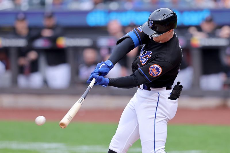 Sep 30, 2023; New York City, New York, USA; New York Mets designated hitter Brett Baty (22) hits an RBI single against the Philadelphia Phillies during the first inning at Citi Field. Mandatory Credit: Brad Penner-USA TODAY Sports