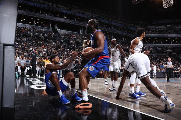 BROOKLYN, NY - NOVEMBER 8: James Harden #1 of the LA Clippers helps up Paul George #13 of the LA Clippers during the game against the Brooklyn Nets on November 8, 2023 at Barclays Center in Brooklyn, New York. NOTE TO USER: User expressly acknowledges and agrees that, by downloading and or using this Photograph, user is consenting to the terms and conditions of the Getty Images License Agreement. Mandatory Copyright Notice: Copyright 2023 NBAE (Photo by Stephen Gosling/NBAE via Getty Images)