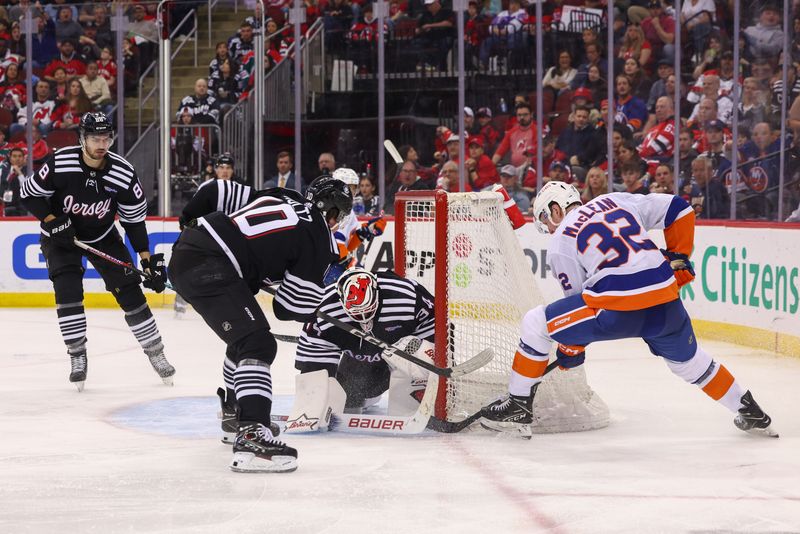 Apr 15, 2024; Newark, New Jersey, USA; New York Islanders center Kyle MacLean (32) scores a goal against the New Jersey Devils during the third period at Prudential Center. Mandatory Credit: Ed Mulholland-USA TODAY Sports