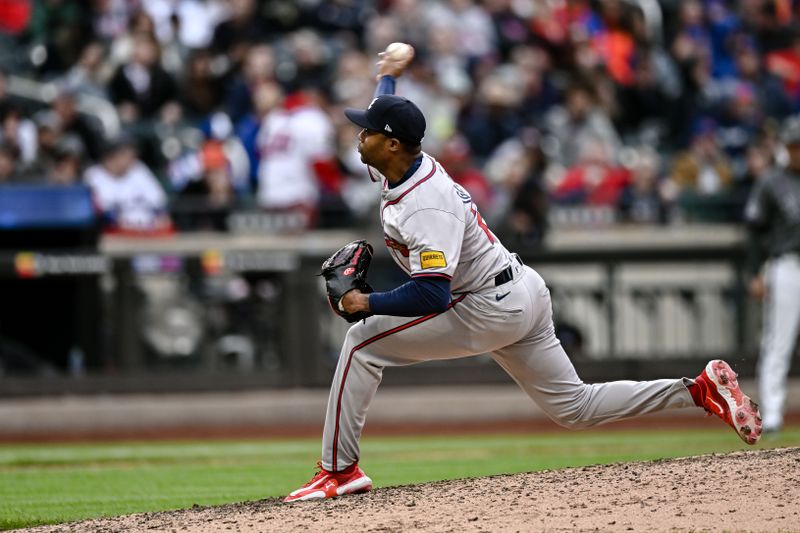 May 11, 2024; New York City, New York, USA; Atlanta Braves pitcher Raisel Iglesias (26) pitches against the New York Mets during the ninth inning at Citi Field. Mandatory Credit: John Jones-USA TODAY Sports