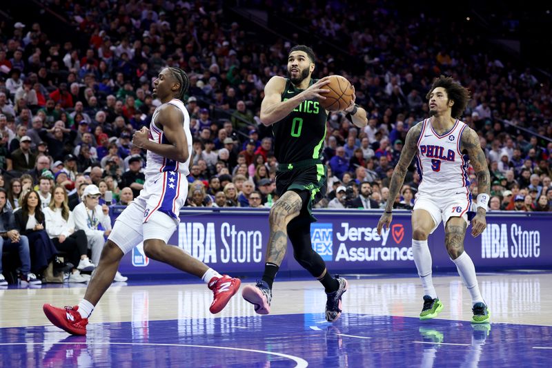 PHILADELPHIA, PENNSYLVANIA - FEBRUARY 02: Jayson Tatum #0 of the Boston Celtics drives to the basket against Tyrese Maxey #0 of the Philadelphia 76ersduring a game at the Wells Fargo Center on February 02, 2025 in Philadelphia, Pennsylvania. NOTE TO USER: User expressly acknowledges and agrees that, by downloading and or using this photograph, User is consenting to the terms and conditions of the Getty Images License Agreement. (Photo by Emilee Chinn/Getty Images)