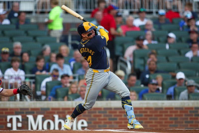 Aug 7, 2024; Atlanta, Georgia, USA; Milwaukee Brewers catcher William Contreras (24) hits a single against the Atlanta Braves in the first inning at Truist Park. Mandatory Credit: Brett Davis-USA TODAY Sports