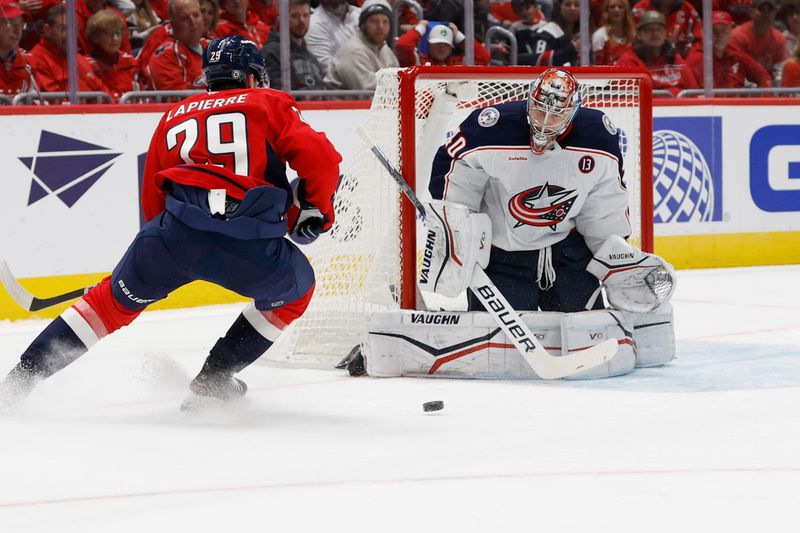 Nov 2, 2024; Washington, District of Columbia, USA; Columbus Blue Jackets goaltender Daniil Tarasov (40) makes a save on Washington Capitals center Hendrix Lapierre (29) in the first period at Capital One Arena. Mandatory Credit: Geoff Burke-Imagn Images