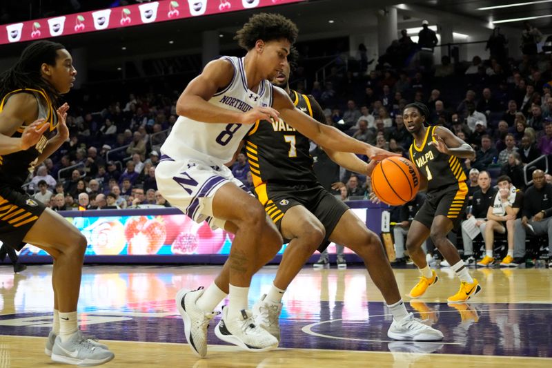 Dec 16, 2025; Evanston, Illinois, USA; Valparaiso Beacons forward JT Pettigrew (7) defends Northwestern Wildcats forward Tre Singleton (8) during the first half at Welsh-Ryan Arena. Mandatory Credit: David Banks-Imagn Images