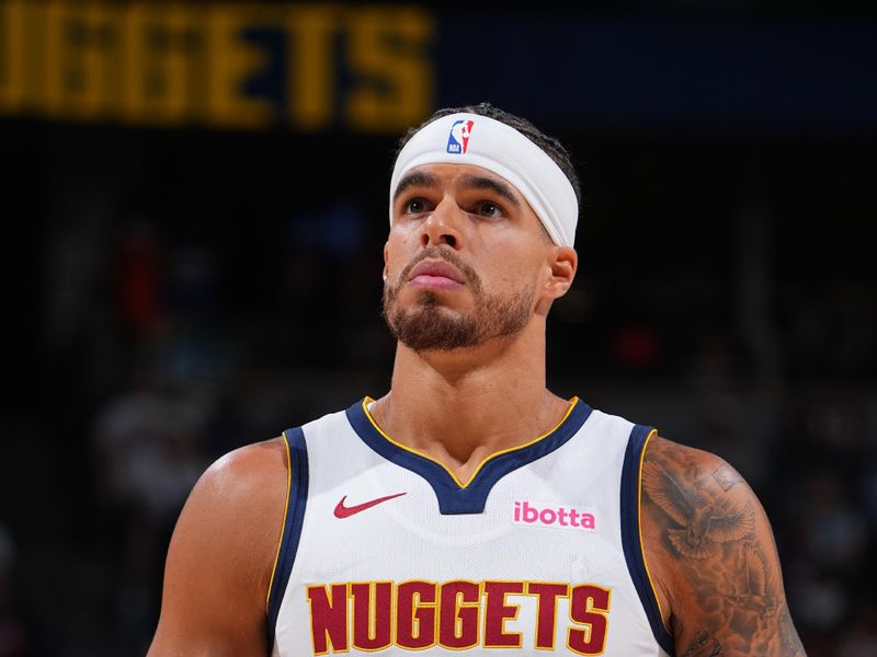 DENVER, CO - OCTOBER 13: Michael Porter Jr. #1 of the Denver Nuggets looks on during the game against the Phoenix Suns on October 13, 2024 at Ball Arena in Denver, Colorado. NOTE TO USER: User expressly acknowledges and agrees that, by downloading and/or using this Photograph, user is consenting to the terms and conditions of the Getty Images License Agreement. Mandatory Copyright Notice: Copyright 2024 NBAE (Photo by Garrett Ellwood/NBAE via Getty Images)