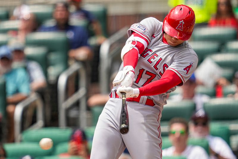 Aug 2, 2023; Cumberland, Georgia, USA; Los Angeles Angels designated hitter Shohei Ohtani (17) singles against the Atlanta Braves during the sixth inning at Truist Park. Mandatory Credit: Dale Zanine-USA TODAY Sports