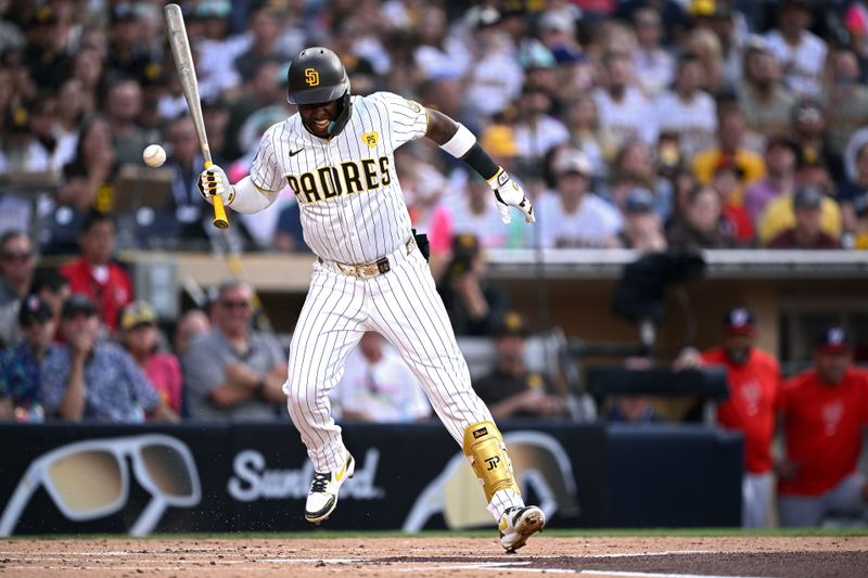 Jun 25, 2024; San Diego, California, USA; San Diego Padres left fielder Jurickson Profar (10) reacts after being hit by a pitch during the first inning against the Washington Nationals at Petco Park. Mandatory Credit: Orlando Ramirez-USA TODAY Sports