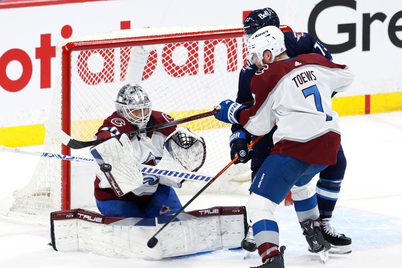 Apr 30, 2024; Winnipeg, Manitoba, CAN; Colorado Avalanche goaltender Alexandar Georgiev (40) makes a blocker save in the third period against the Winnipeg Jets in game five of the first round of the 2024 Stanley Cup Playoffs at Canada Life Centre. Mandatory Credit: James Carey Lauder-USA TODAY Sports