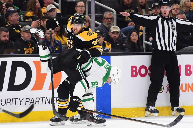 Oct 24, 2024; Boston, Massachusetts, USA;  Boston Bruins defenseman Parker Wotherspoon (29) and Dallas Stars right wing Evgenii Dadonov (63) battle along the boards during the second period at TD Garden. Mandatory Credit: Bob DeChiara-Imagn Images