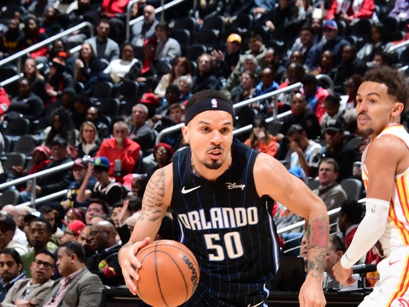 ATLANTA, GA - JANUARY 17: Cole Anthony #50 of the Orlando Magic goes to the basket during the game on January 17, 2024 at State Farm Arena in Atlanta, Georgia.  NOTE TO USER: User expressly acknowledges and agrees that, by downloading and/or using this Photograph, user is consenting to the terms and conditions of the Getty Images License Agreement. Mandatory Copyright Notice: Copyright 2024 NBAE (Photo by Scott Cunningham/NBAE via Getty Images)