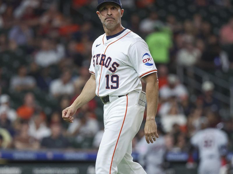 May 2, 2024; Houston, Texas, USA; Houston Astros manager Joe Espada (19) walks off the field after a pitching change during the sixth inning against the Cleveland Guardians at Minute Maid Park. Mandatory Credit: Troy Taormina-USA TODAY Sports