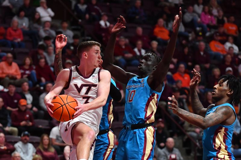 Feb 13, 2024; Blacksburg, Virginia, USA; Virginia Tech Hokies guard Sean Pedulla (3) looks to pass the ball as Florida State Seminoles forward Taylor Bol Bowen (10) defends during the second half at Cassell Coliseum. Mandatory Credit: Brian Bishop-USA TODAY Sports