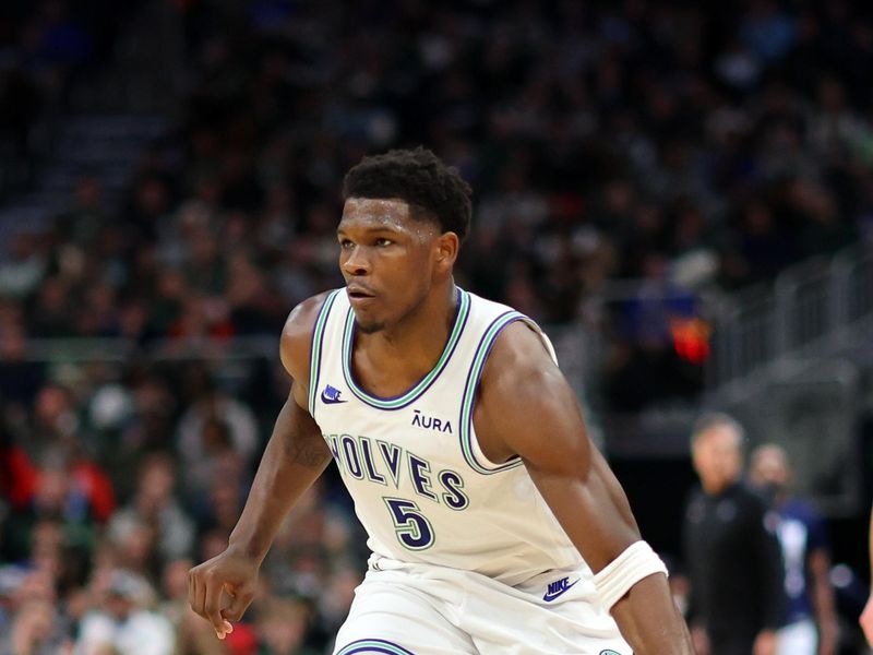 MILWAUKEE, WISCONSIN - FEBRUARY 08: Anthony Edwards #5 of the Minnesota Timberwolves handles the ball during a game against the Milwaukee Bucks at Fiserv Forum on February 08, 2024 in Milwaukee, Wisconsin. NOTE TO USER: User expressly acknowledges and agrees that, by downloading and or using this photograph, User is consenting to the terms and conditions of the Getty Images License Agreement. (Photo by Stacy Revere/Getty Images)