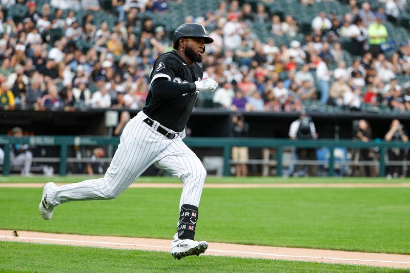 Aug 26, 2023; Chicago, Illinois, USA; Chicago White Sox center fielder Luis Robert Jr. (88) runs to second base after hitting a double against the Oakland Athletics during the first inning at Guaranteed Rate Field. Mandatory Credit: Kamil Krzaczynski-USA TODAY Sports