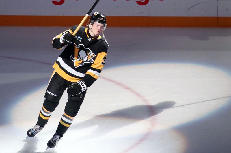 Nov 16, 2024; Pittsburgh, Pennsylvania, USA;  Pittsburgh Penguins defenseman Owen Pickering (38) reacts after being named a star of the game in his NHL debut against the San Jose Sharks at PPG Paints Arena. Mandatory Credit: Charles LeClaire-Imagn Images