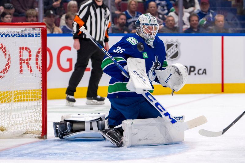 Apr 16, 2024; Vancouver, British Columbia, CAN; Vancouver Canucks goalie Thatcher Demko (35) makes a save against the Calgary Flames in the second period at Rogers Arena. Mandatory Credit: Bob Frid-USA TODAY Sports