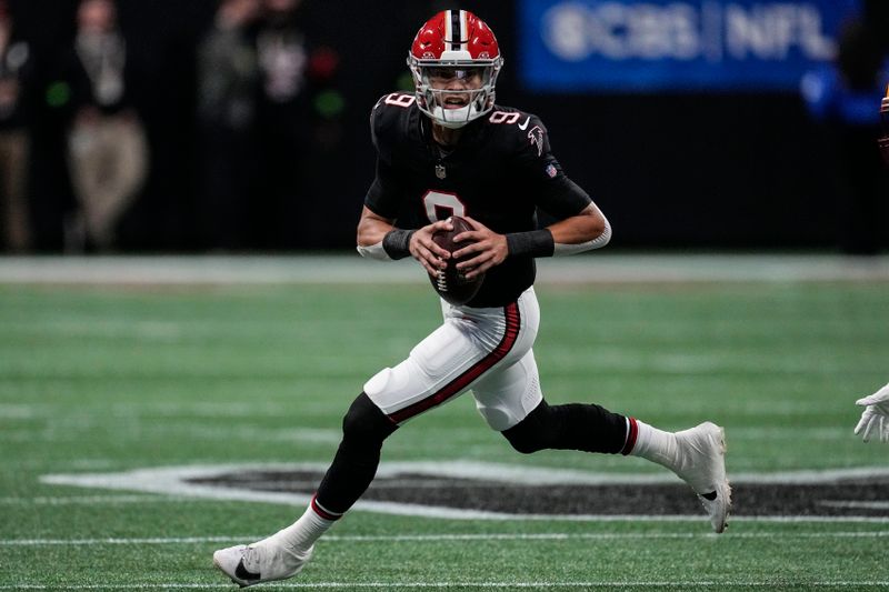 Atlanta Falcons quarterback Desmond Ridder (9) runs out of the pocket against the Washington Commanders during the first half of an NFL football game, Sunday, Oct. 15, 2023, in Atlanta. (AP Photo/John Bazemore)