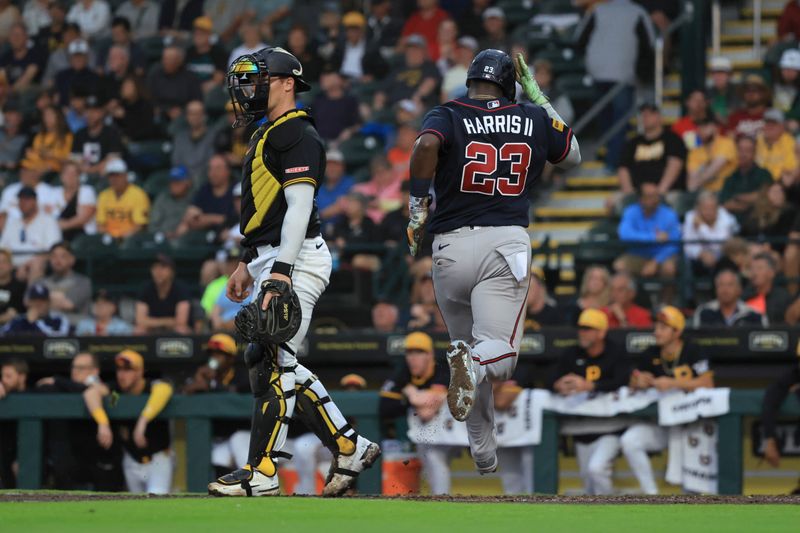 Mar 12, 2026; Bradenton, Florida, USA;  Atlanta Braves center fielder Michael Harris II (23) scored a run as Pittsburgh Pirates catcher Henry Davis (32) looks on during the sixth inning at LECOM Park. Mandatory Credit: Kim Klement Neitzel-Imagn Images