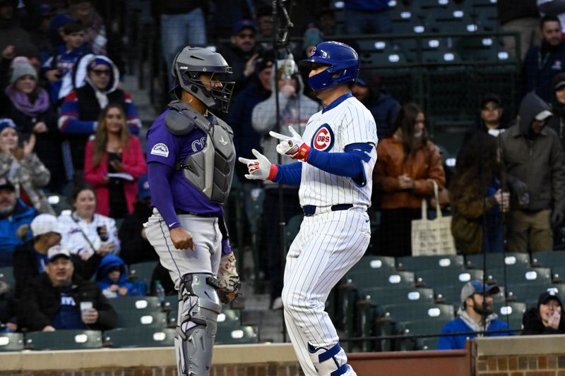 Apr 2, 2024; Chicago, Illinois, USA; Chicago Cubs right fielder Seiya Suzuki (27) points after hitting a two-run home run against the Colorado Rockies during the first inning at Wrigley Field. Mandatory Credit: Matt Marton-USA TODAY Sports