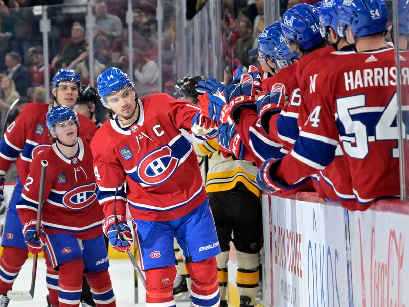 Mar 14, 2024; Montreal, Quebec, CAN; Montreal Canadiens forward Nick Suzuki (14) celebrates with teammates after scoring against the Boston Bruins during the first period at the Bell Centre. Mandatory Credit: Eric Bolte-USA TODAY Sports