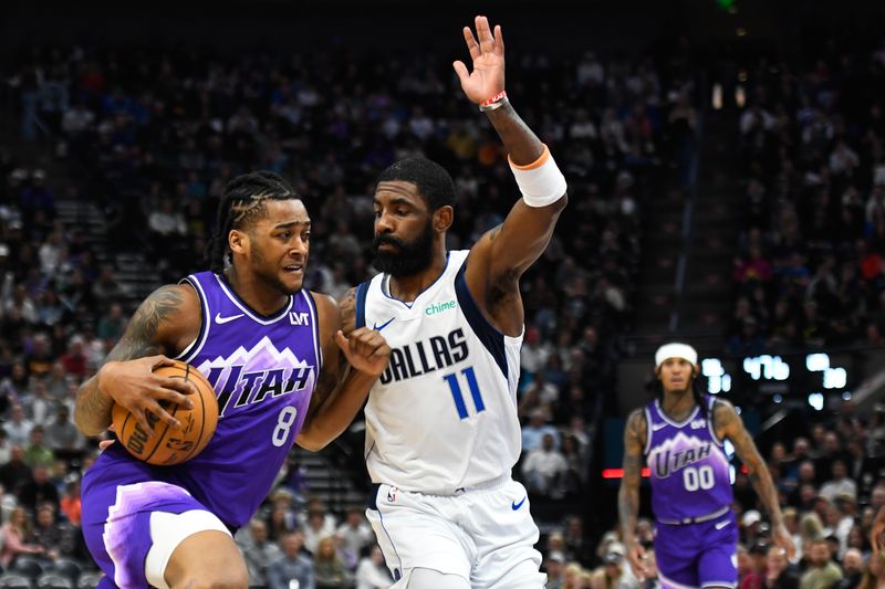 SALT LAKE CITY, UTAH - MARCH 25: Brice Sensabaugh #8 of the Utah Jazz drives into Kyrie Irving #11 of the Dallas Mavericks during the first half of a game at Delta Center on March 25, 2024 in Salt Lake City, Utah. NOTE TO USER: User expressly acknowledges and agrees that, by downloading and or using this photograph, User is consenting to the terms and conditions of the Getty Images License Agreement. (Photo by Alex Goodlett/Getty Images)