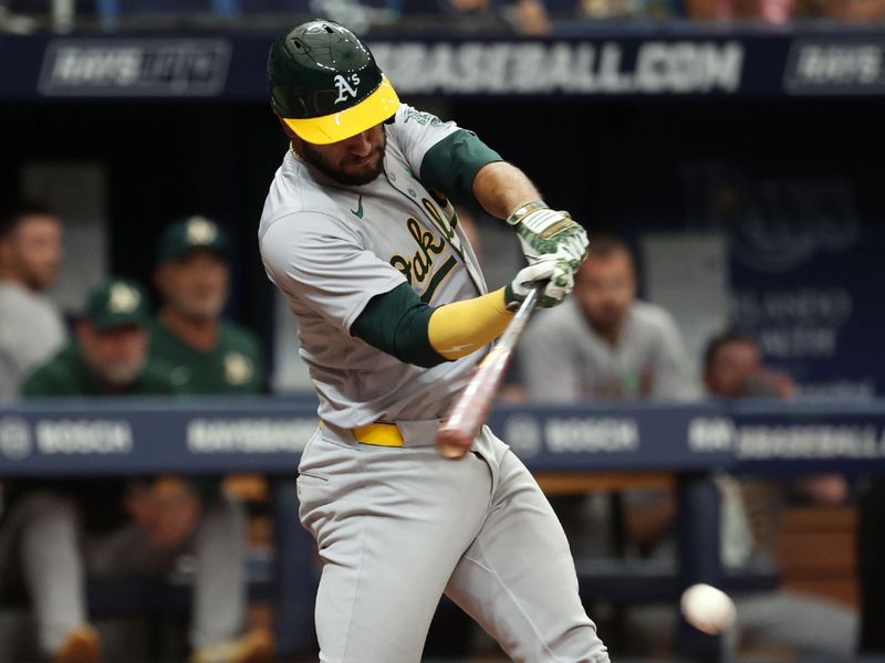 May 30, 2024; St. Petersburg, Florida, USA; Oakland Athletics third baseman Abraham Toro (31) singles against the Tampa Bay Rays during the third inning at Tropicana Field. Mandatory Credit: Kim Klement Neitzel-USA TODAY Sports