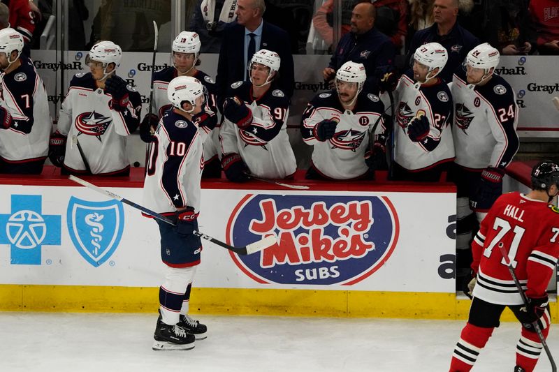 Dec 1, 2024; Chicago, Illinois, USA; Columbus Blue Jackets left wing Dmitri Voronkov (10) celebrates his goal against the Chicago Blackhawks during the third period at United Center. Mandatory Credit: David Banks-Imagn Images