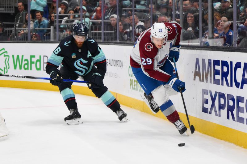 Nov 13, 2023; Seattle, Washington, USA; Colorado Avalanche center Nathan MacKinnon (29) plays the puck against the Seattle Kraken during the third period at Climate Pledge Arena. Mandatory Credit: Steven Bisig-USA TODAY Sports