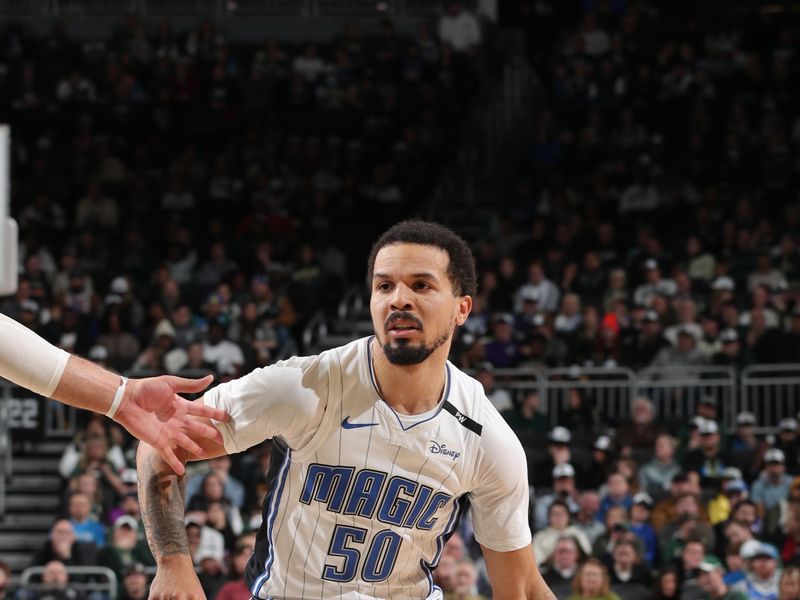 MILWAUKEE, WI - JANUARY 15: Cole Anthony #50 of the Orlando Magic handles the ball during the game against the Milwaukee Bucks on January 15, 2025 at Fiserv Forum Center in Milwaukee, Wisconsin. NOTE TO USER: User expressly acknowledges and agrees that, by downloading and or using this Photograph, user is consenting to the terms and conditions of the Getty Images License Agreement. Mandatory Copyright Notice: Copyright 2025 NBAE (Photo by Gary Dineen/NBAE via Getty Images).