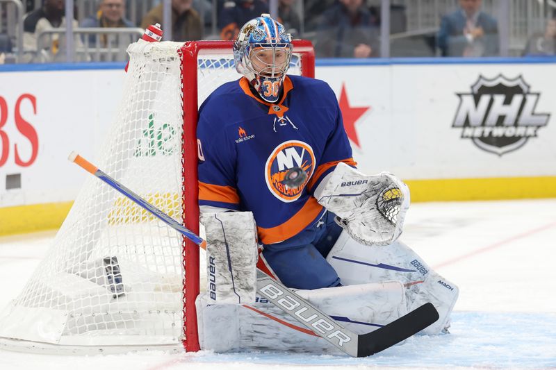 Nov 5, 2024; Elmont, New York, USA; New York Islanders goaltender Ilya Sorokin (30) makes a save against the Pittsburgh Penguins during the first period at UBS Arena. Mandatory Credit: Brad Penner-Imagn Images