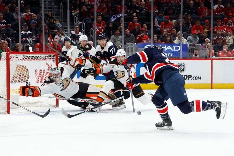 Jan 16, 2024; Washington, District of Columbia, USA; Washington Capitals defenseman Ethan Bear (25) scores a goal on Anaheim Ducks goaltender John Gibson (36) in the first period at Capital One Arena. Mandatory Credit: Geoff Burke-USA TODAY Sports