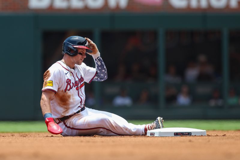 Jul 7, 2024; Atlanta, Georgia, USA; Atlanta Braves center fielder Jarred Kelenic (24) slides safely into second with a stolen base against the Philadelphia Phillies in the first inning at Truist Park. Mandatory Credit: Brett Davis-USA TODAY Sports
