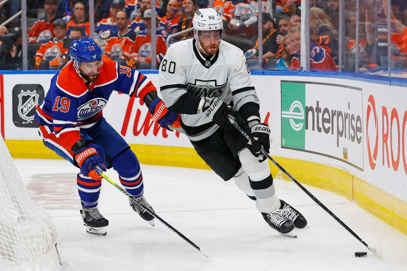 May 1, 2024; Edmonton, Alberta, CAN;Los Angeles Kings forward Pierre-Luc Dubois (80) protects the puck from Edmonton Oilers forward Adam Henrique (19) during the second period in game five of the first round of the 2024 Stanley Cup Playoffs at Rogers Place. Mandatory Credit: Perry Nelson-USA TODAY Sports