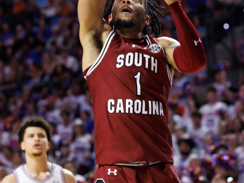 Feb 15, 2025; Gainesville, Florida, USA; South Carolina Gamecocks guard Jacobi Wright (1) makes a layup against the Florida Gators during the first half at Exactech Arena at the Stephen C. O'Connell Center. Mandatory Credit: Matt Pendleton-Imagn Images