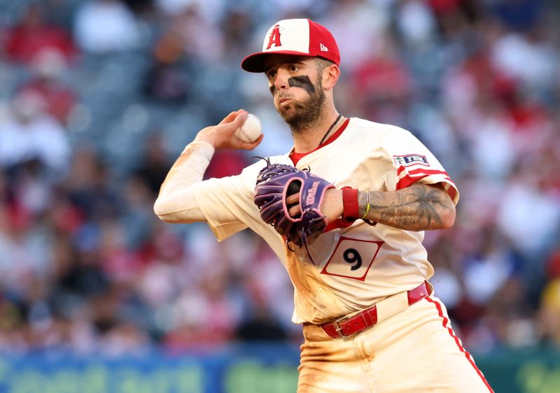 Jun 6, 2025; Anaheim, California, USA; Los Angeles Angels shortstop Zach Neto (9) throws to first for an out during the fourth inning against the Seattle Mariners at Angel Stadium. Mandatory Credit: Jason Parkhurst-Imagn Images