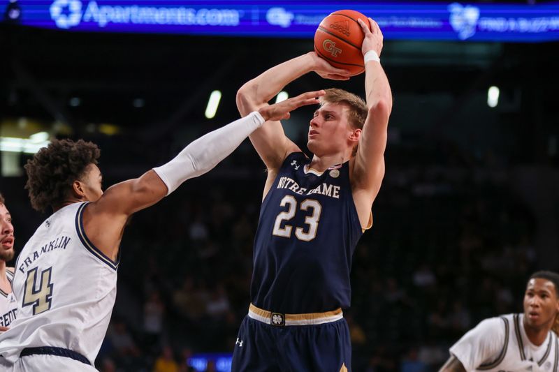 Feb 8, 2023; Atlanta, Georgia, USA; Notre Dame Fighting Irish guard Dane Goodwin (23) shoots past Georgia Tech Yellow Jackets forward Javon Franklin (4) in the first half at McCamish Pavilion. Mandatory Credit: Brett Davis-USA TODAY Sports