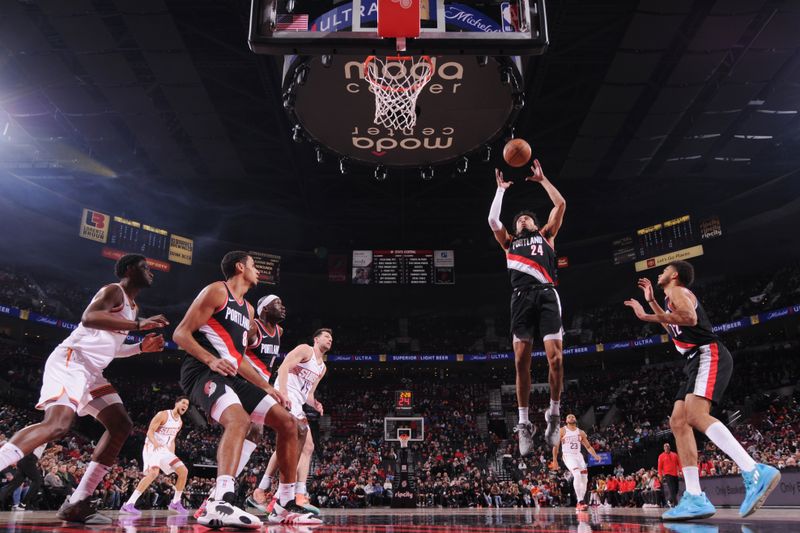 PORTLAND, OR - JANUARY 14: Justin Minaya #24 of the Portland Trail Blazers rebounds the ball during the game against the Phoenix Suns on January 14, 2024 at the Moda Center Arena in Portland, Oregon. NOTE TO USER: User expressly acknowledges and agrees that, by downloading and or using this photograph, user is consenting to the terms and conditions of the Getty Images License Agreement. Mandatory Copyright Notice: Copyright 2024 NBAE (Photo by Cameron Browne/NBAE via Getty Images)