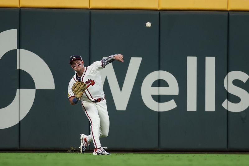 Aug 21, 2024; Atlanta, Georgia, USA; Atlanta Braves left fielder Jarred Kelenic (24) throws the ball against the Philadelphia Phillies in the sixth inning at Truist Park. Mandatory Credit: Brett Davis-USA TODAY Sports